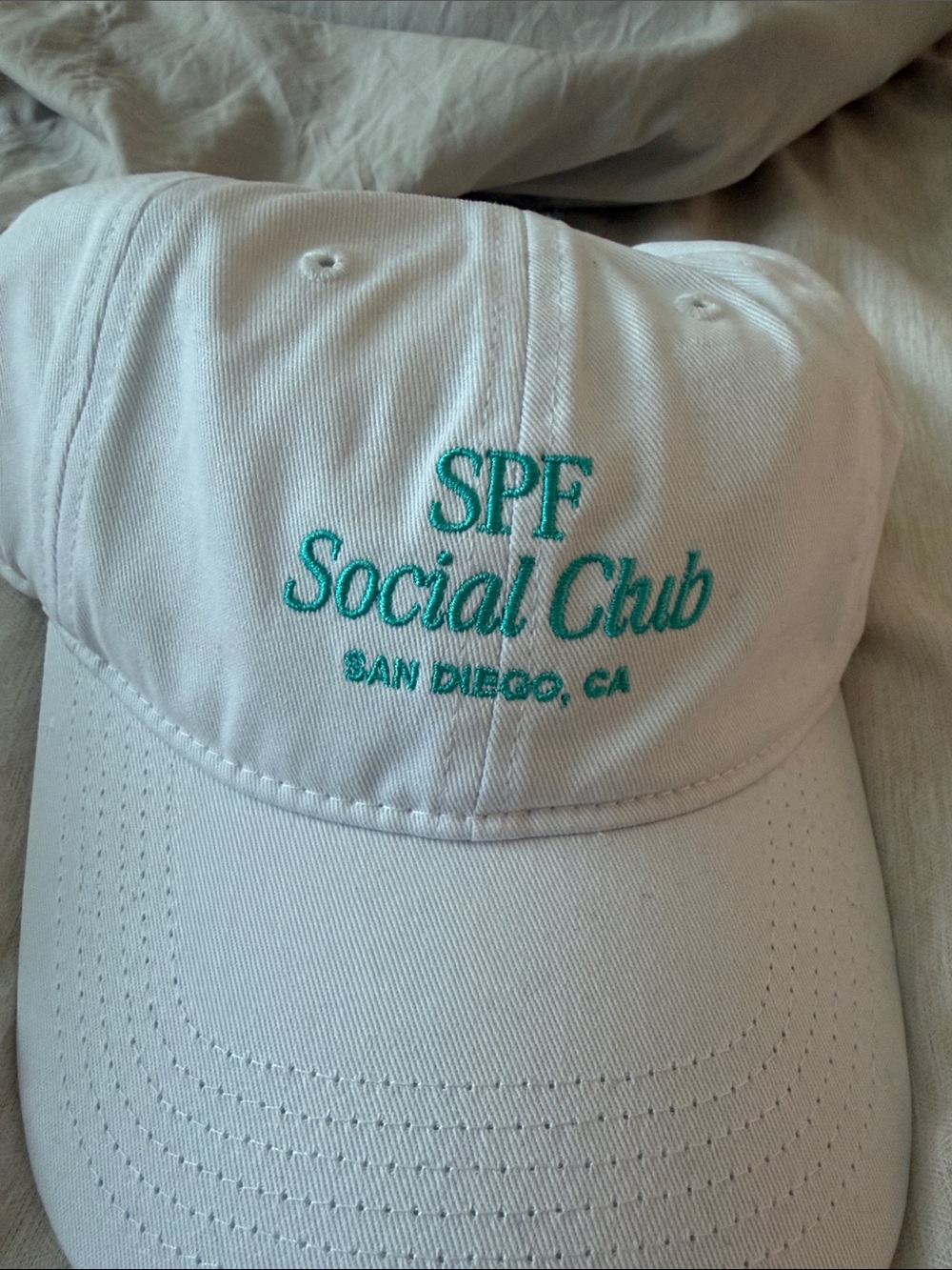 COOLA White Baseball Cap with Teal Logo Embroidery